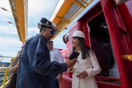 Assistant Secretary Katie Jereza and other stakeholders wearing hard hats and talking during a tour of the San Juan Power Plant.