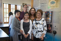 The family of Sam Billison stand with the Navajo Code Talker G.I. Joe on display at LM's Atomic Legacy Cabin in Grand Junction, Colorado.