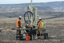 Workers operate a GeoProbe at the Grand Junction, Colorado, Disposal Site to extract multiple core samples through the cell cover.