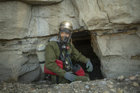 Aaron Sidder of Bat Conservation International prepares to enter a mine portal in New Mexico. (Photo by Bill Hatcher/BCI.)