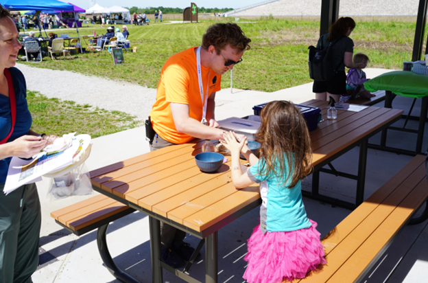 Younger visitors built seed balls for planting at home with help from Weldon Spring Site Interpretive Center staff members.