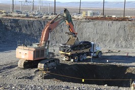 Debris and soil removed from a remediated waste site is packaged in large containers and transported to Hanford’s onsite landfill for safe disposal.