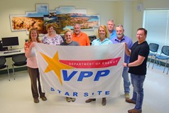 Employees at WTP display a flag recognizing the plant as a DOE Voluntary Protection Program Star status site.