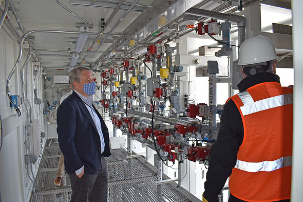 During a visit to the Hanford Site, EM chief Ike White (left) got a look inside enclosures for a vital pretreatment system.