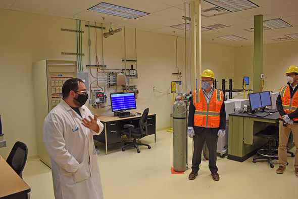 EM chief Ike White (right) stopped by WTP's Analytical Laboratory, the first nuclear facility to move from startup testing to commissioning.