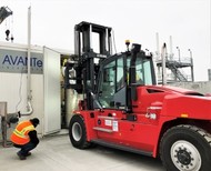 An employee with Washington River Protection Solutions is near a forklift near the Tank-Side Cesium Removal system.