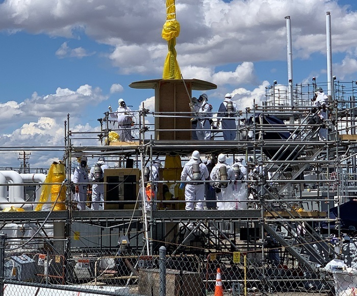 Workers remove old systems and equipment and install new equipment.