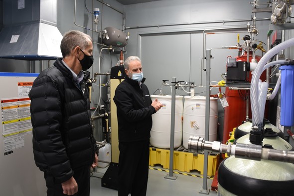 Brian Vance, Hanford Site manager, left, is given a tour of the Tank-Side Cesium Removal (TSCR) system ancillary enclosure.