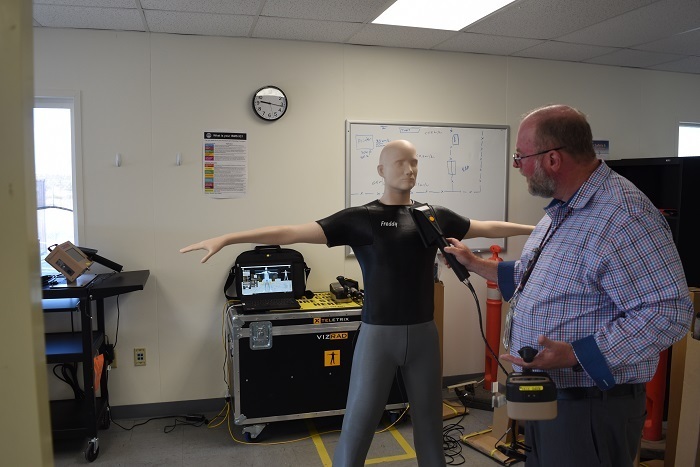 Waste Treatment Plant Radiological Engineer Steven Goodrich demonstrates contamination screening using the VIZRAD Frisk simulator.