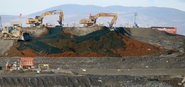 Backhoe tractor digging dirt