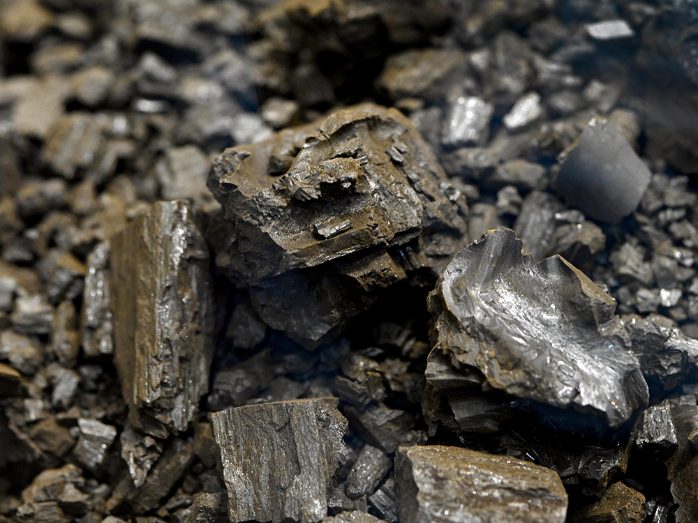 Close-up of dark brownish-gray nuclear fuel salt 