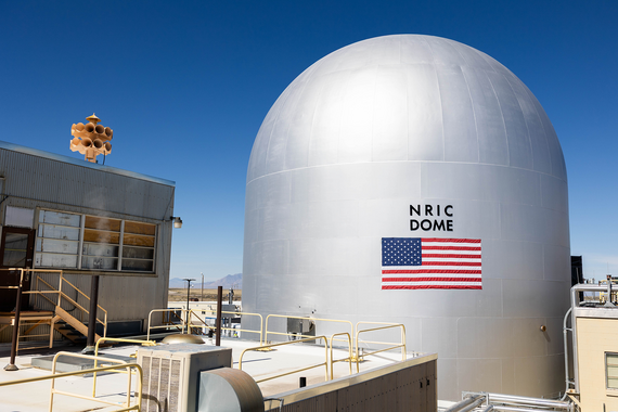 Photo of the DOME microreactor test bed, a silver dome-shaped building against a blue sky.