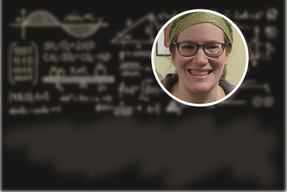 Photo of Rachel Mandelbaum (a white woman in a head scarf) against a background of a blackboard with blurred equations