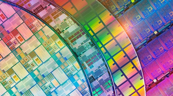Stylized illustration of silicon wafers of many different rainbow colors