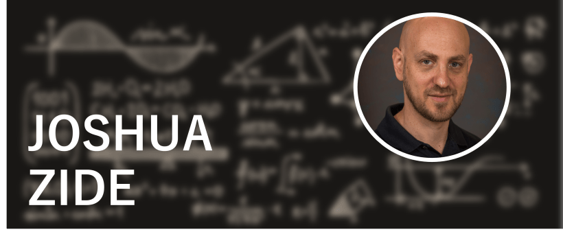 Headshot of Joshua Zide (a white man in a black shirt) against a background of a blackboard with blurred equations