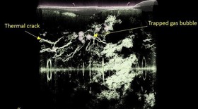 Microtomographic 3D snapshots of complex structure of thermal cracks and air bubbles in a 3D printed metal