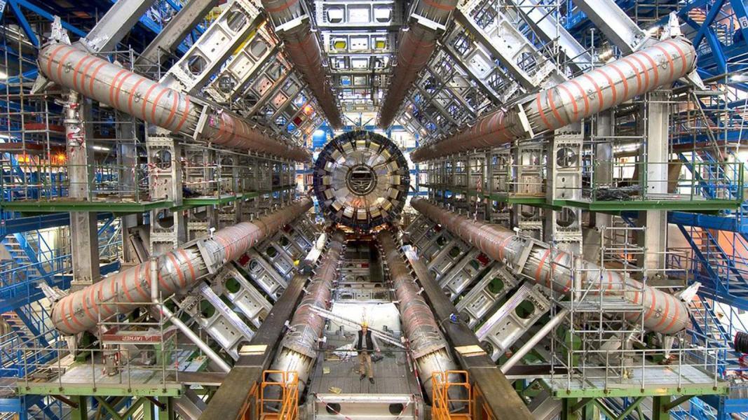 The main detector of the ATLAS experiment, a massive machine with 8 tubes sticking out of a central hub like a starfish