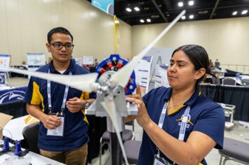 College students working on a model windmill