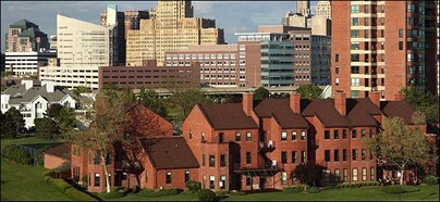 Brick buildings in front of skyscrapers