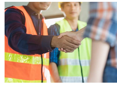 Two workers shake hands