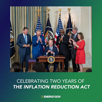 Celebrating Two Years of the Inflation Reduction Act; image of President Biden signing legislation