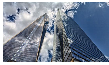 2 skyscrapers with clouds 