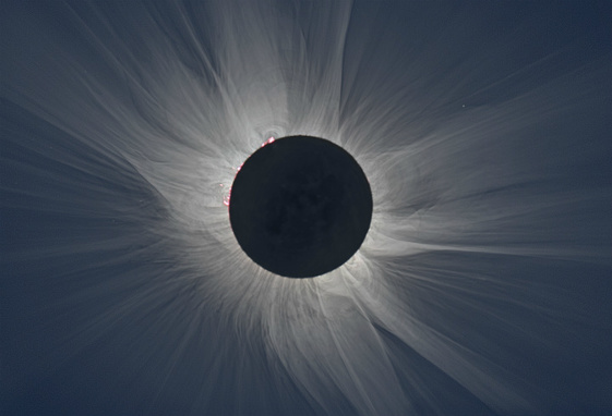 The black circle of the moon blocks the sun, showing only bright light streaming from its edges.
