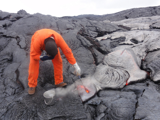 USGS scientist collects lava samples