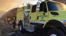 BLM yellow fire engine during sunset