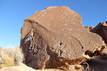 person climbing rock fixture