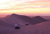 Imperial Sand dunes at dusk while ohvs drift into the night