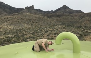 Photograph of CAPT Chris Glime conducting an inspection on a water facility in the Intermountain Region of the National Park Service