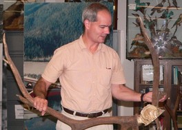 Mark Madison holding a set of antlers
