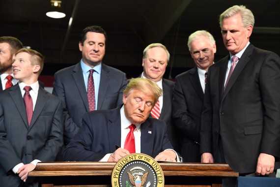 President Donald J. Trump sign a Presidential Memorandum.