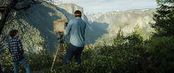 Photograph of photographer and son with mountains in the background