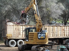 Heavy equipment preforming cleanup operations. 