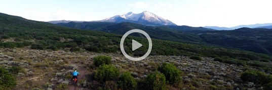 Man bikes on mountain.