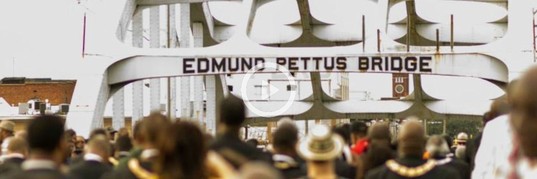 Reenactment of the civil rights march across the Edmund Pettus  Bridge.  