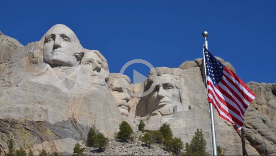 Mount Rushmore is a tall gray mountain with the faces of four presidents carved on it.