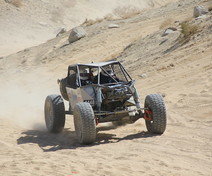 Off road vehicle in the sand.