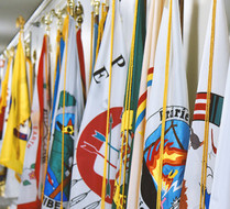 A close up of several flags that are lined up.
