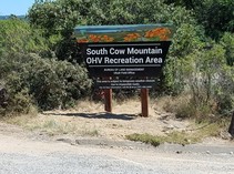 A sign that reads South Cow Mountain OHV Recreation Area.