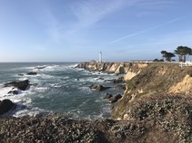 A lighthouse on a coastal bluff.