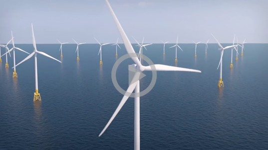 wind turbines surrounded by ocean