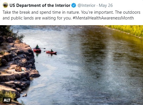 Secretary Haaland retweet's US Interior's picture of two kayakers on a mountain river