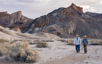 Two people walking in the Amargosa ACEC is a desert oasis.