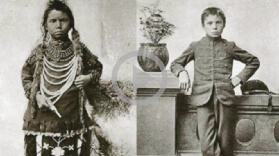 An old black and white photo of tribal children