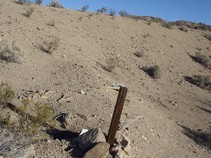 A mining claim stake in the ground. 