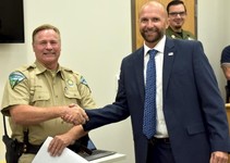 Deputy U.S. Marshal Pete Thompson shakes hands with Grand Canyon-Parashant National Monument Ranger Brice Provost