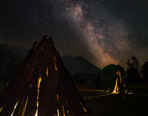 Cedar Bark Houses at the San Joaquin River Gorge under a starlit sky at night_by Jesse Pluim